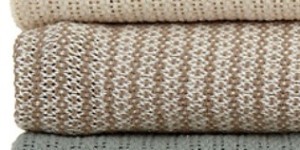 This is a cotton throw in tan and beige.
