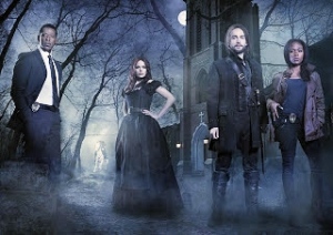 The cast of Sleepy Hollow poses in the forest.